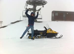 Mt Hutt electrician Rob Nesbitt jumps for joy in snow at the top of the Quad Chair.